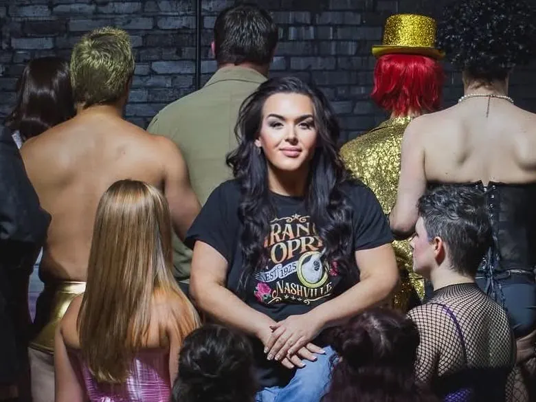 Jaimie Agan, co-owner of Elevate Marketing Collective, with a theater cast
